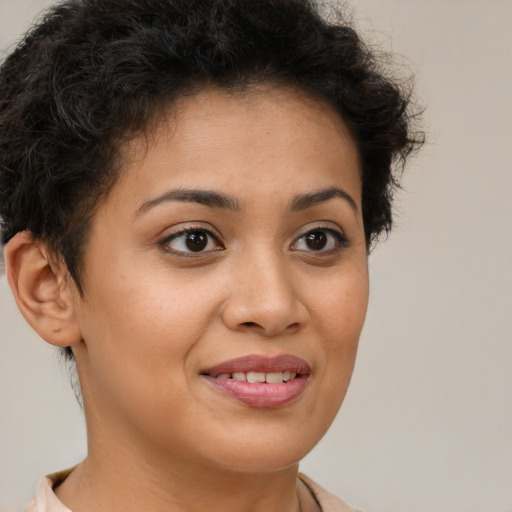 Joyful latino young-adult female with short  brown hair and brown eyes
