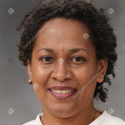 Joyful black adult female with short  brown hair and brown eyes