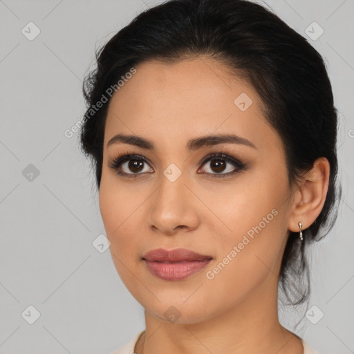 Joyful latino young-adult female with medium  brown hair and brown eyes