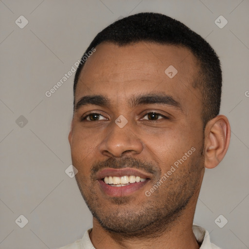 Joyful black young-adult male with short  black hair and brown eyes