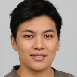 Joyful asian young-adult female with short  brown hair and brown eyes