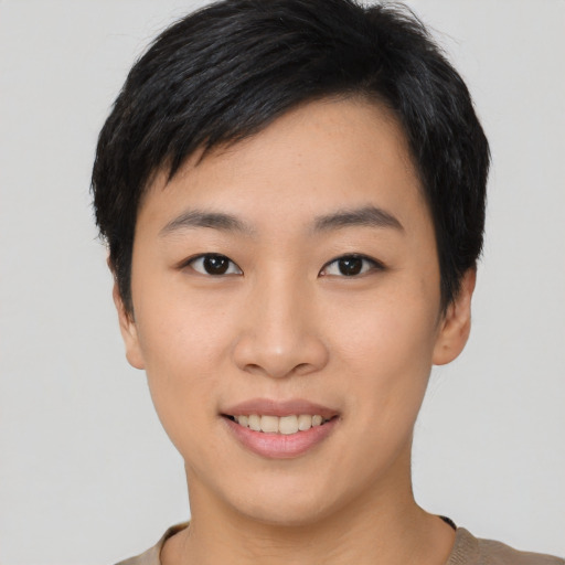 Joyful asian young-adult female with short  black hair and brown eyes