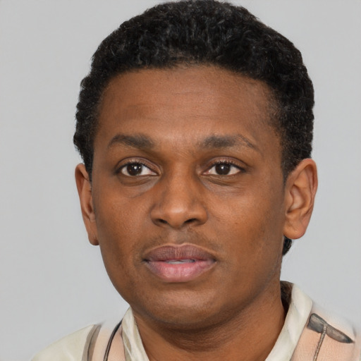 Neutral black young-adult male with short  black hair and brown eyes