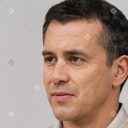 Neutral white adult male with short  black hair and brown eyes