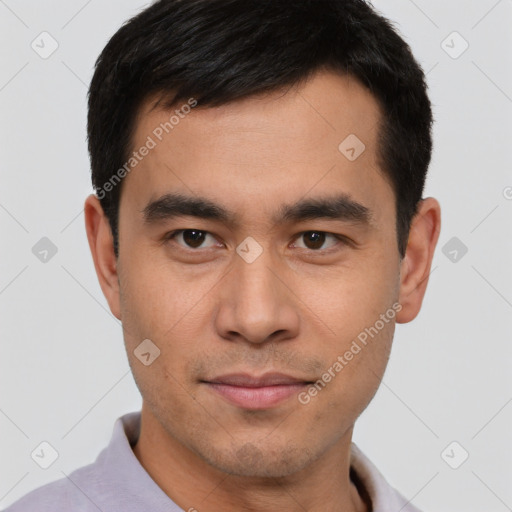 Joyful asian young-adult male with short  brown hair and brown eyes