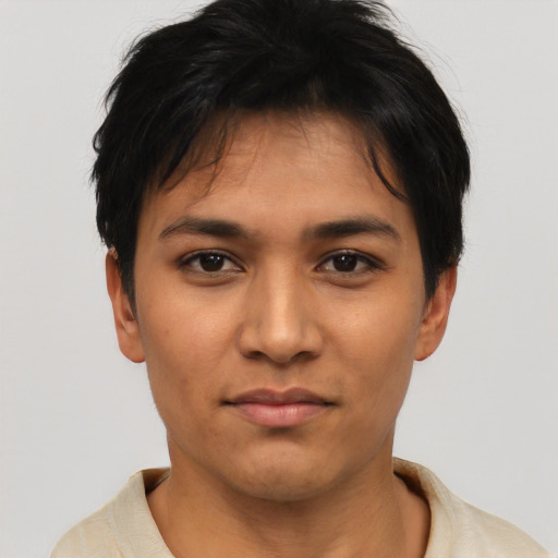 Joyful latino young-adult female with short  black hair and brown eyes