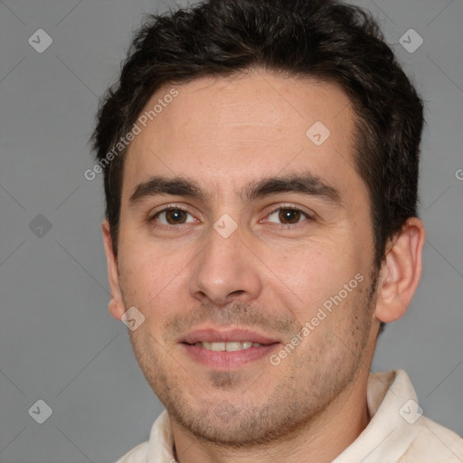 Joyful white adult male with short  brown hair and brown eyes