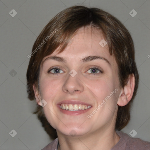 Joyful white young-adult female with medium  brown hair and blue eyes