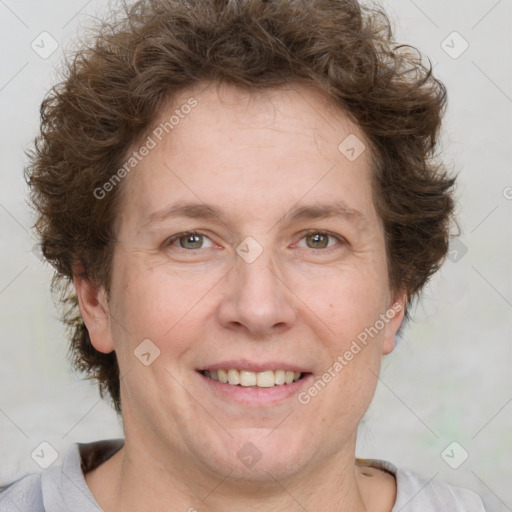 Joyful white adult female with short  brown hair and brown eyes