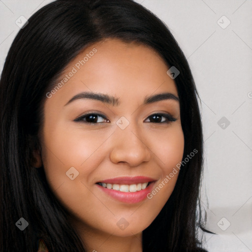 Joyful latino young-adult female with long  brown hair and brown eyes