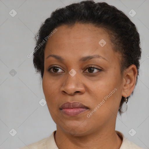 Joyful black adult female with short  brown hair and brown eyes