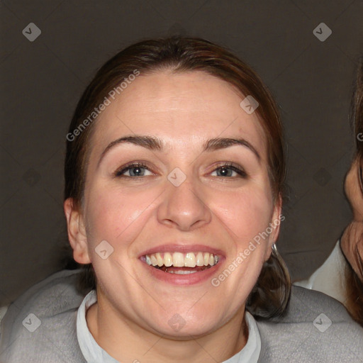 Joyful white adult female with medium  brown hair and blue eyes