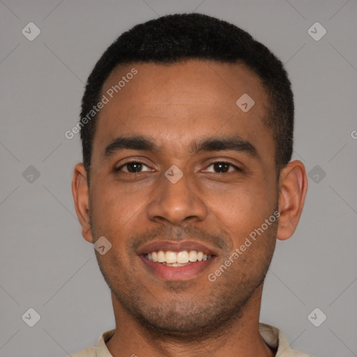 Joyful black young-adult male with short  black hair and brown eyes