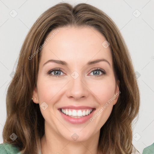 Joyful white young-adult female with medium  brown hair and green eyes