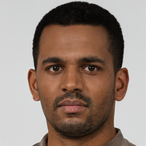 Neutral black young-adult male with short  black hair and brown eyes