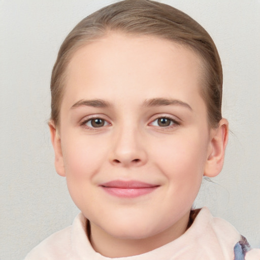 Joyful white child female with medium  brown hair and brown eyes