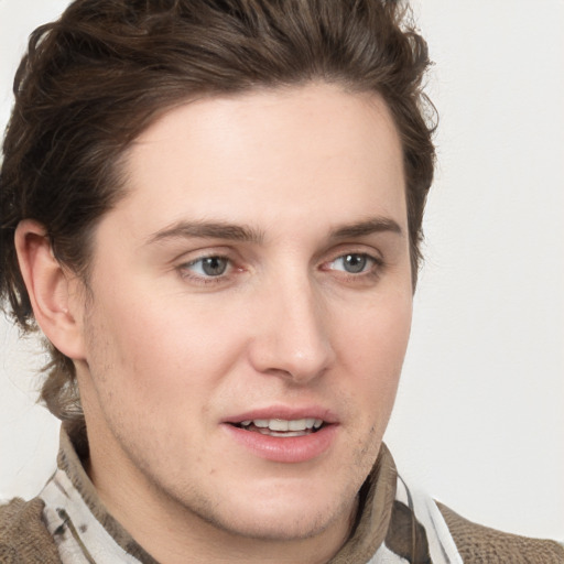 Joyful white young-adult male with medium  brown hair and brown eyes