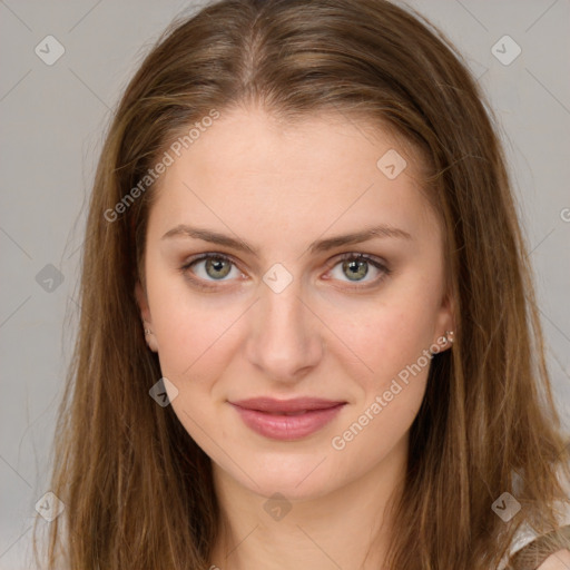 Joyful white young-adult female with long  brown hair and green eyes