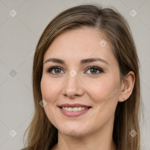 Joyful white young-adult female with long  brown hair and brown eyes