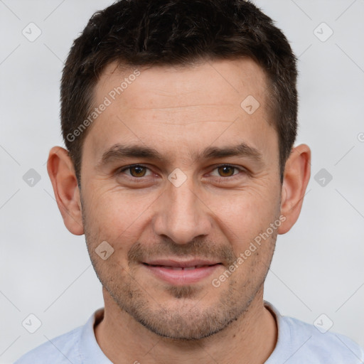 Joyful white adult male with short  brown hair and brown eyes