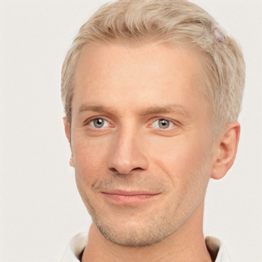 Joyful white adult male with short  brown hair and grey eyes