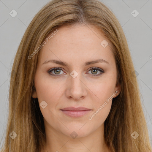 Joyful white young-adult female with long  brown hair and green eyes