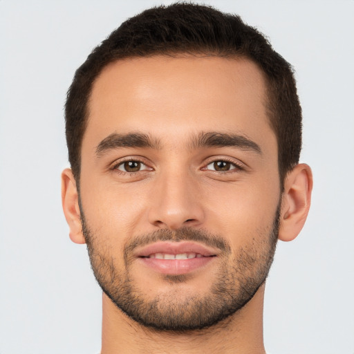 Joyful white young-adult male with short  brown hair and brown eyes