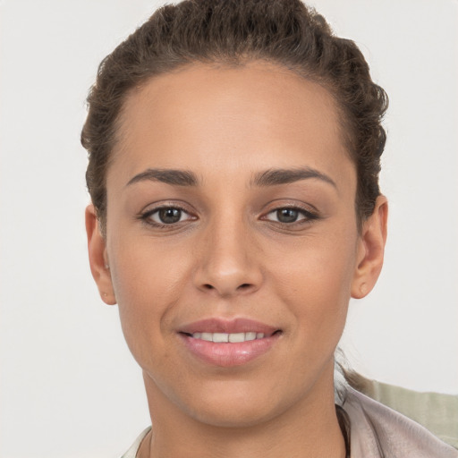 Joyful white young-adult female with short  brown hair and brown eyes