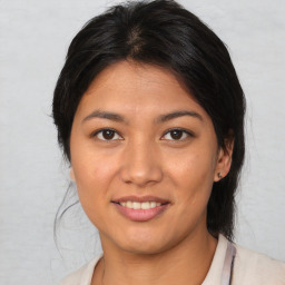 Joyful asian young-adult female with medium  brown hair and brown eyes