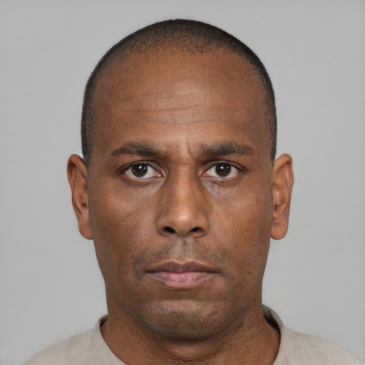 Neutral black adult male with short  black hair and brown eyes