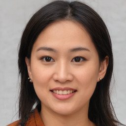 Joyful asian young-adult female with medium  brown hair and brown eyes