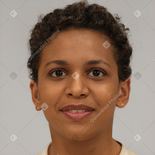 Joyful black young-adult female with short  brown hair and brown eyes