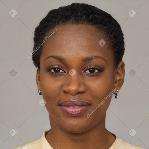 Joyful black young-adult female with short  black hair and brown eyes