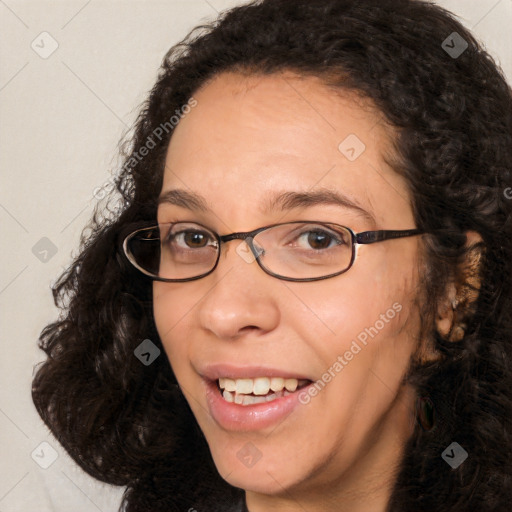 Joyful white adult female with long  brown hair and brown eyes