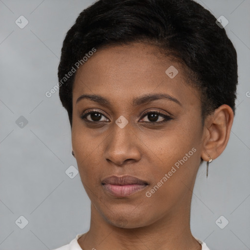 Joyful black young-adult female with short  brown hair and brown eyes