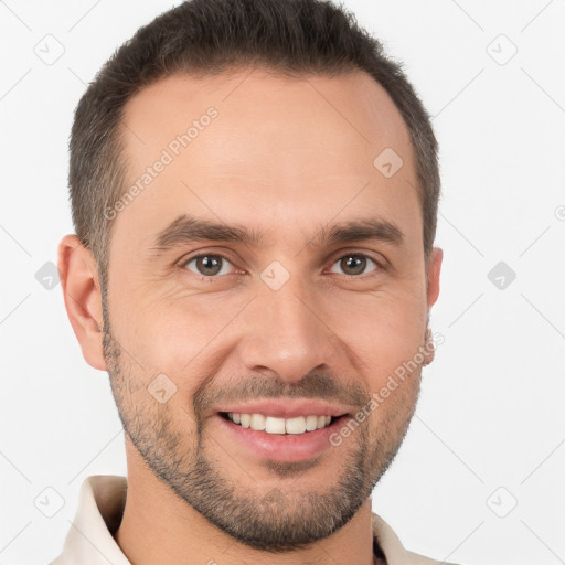 Joyful white young-adult male with short  brown hair and brown eyes