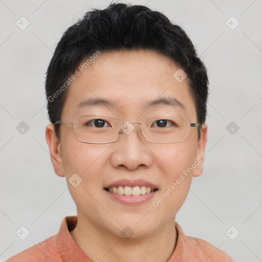 Joyful asian young-adult male with short  brown hair and brown eyes