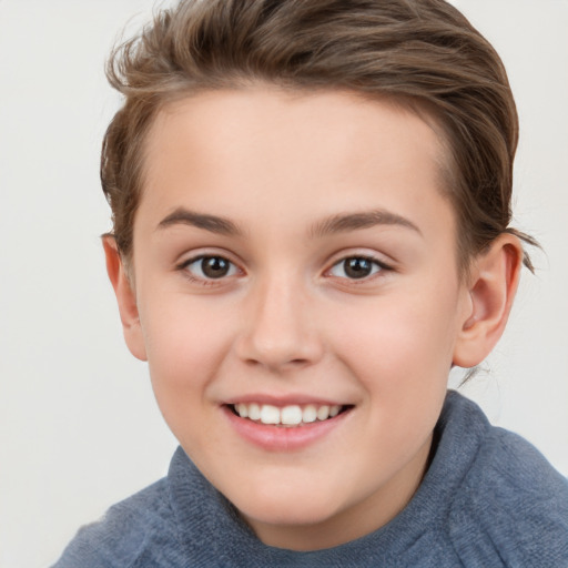 Joyful white child female with short  brown hair and brown eyes