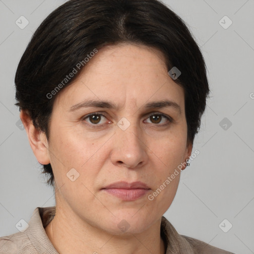 Joyful white adult female with medium  brown hair and brown eyes