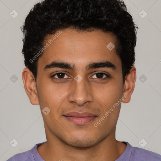 Joyful latino young-adult male with short  brown hair and brown eyes