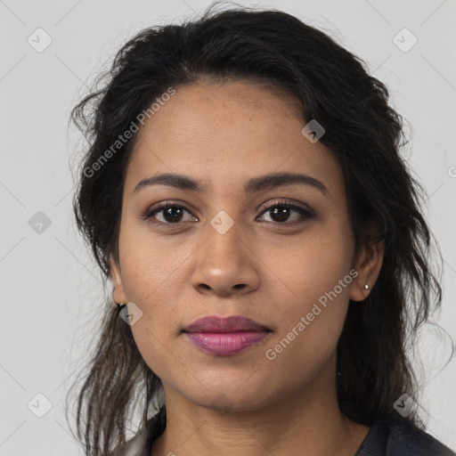 Joyful latino young-adult female with long  brown hair and brown eyes