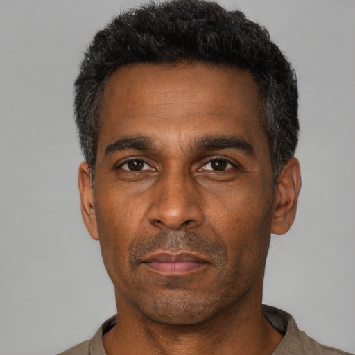 Neutral black adult male with short  black hair and brown eyes