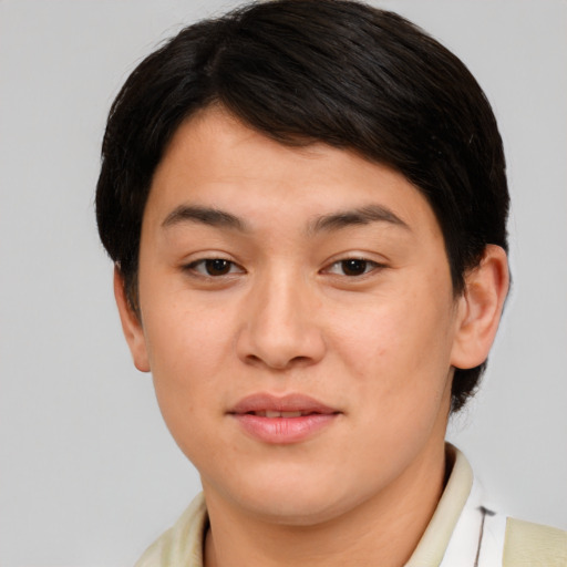 Joyful asian young-adult female with short  brown hair and brown eyes