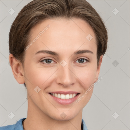 Joyful white young-adult female with short  brown hair and grey eyes