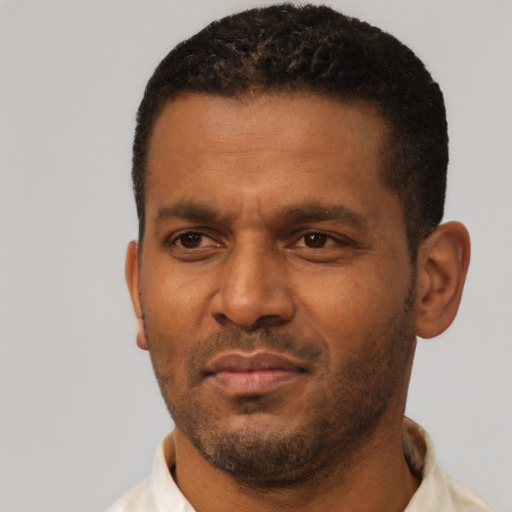 Neutral latino adult male with short  black hair and brown eyes