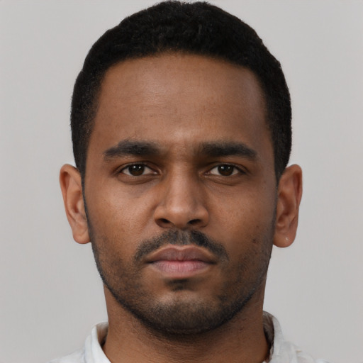 Neutral black young-adult male with short  brown hair and brown eyes