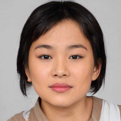 Neutral asian young-adult female with medium  black hair and brown eyes