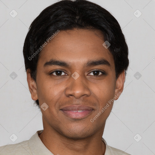 Joyful black young-adult male with short  black hair and brown eyes