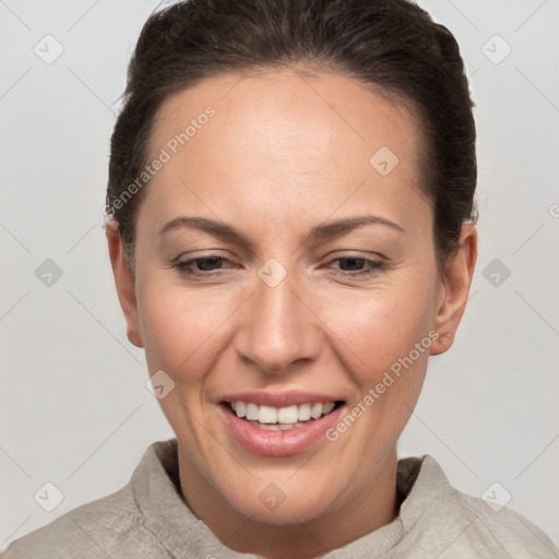 Joyful white adult female with short  brown hair and brown eyes