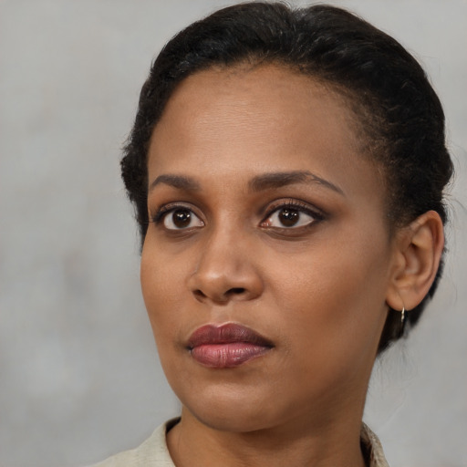 Neutral black young-adult female with short  brown hair and brown eyes